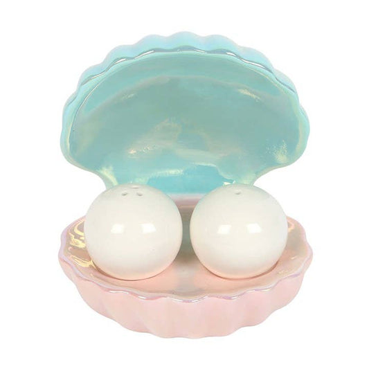 Salt and pepper egg cups in the shape of an iridescent coastal clam shell