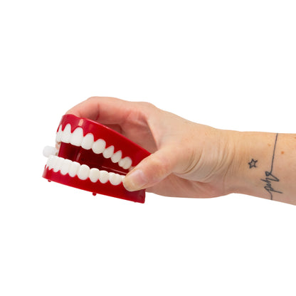 TEETH THAT CLICK LIKE A CLOCK