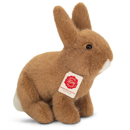 Pluche knuffel van een zittend bruin konijn