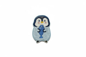 Pinguïn strijkpatch met vis