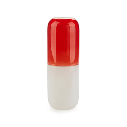 Bouteille de pilules d'eau et verre à boire