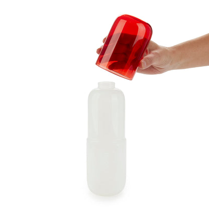 Bouteille de pilules d'eau et verre à boire