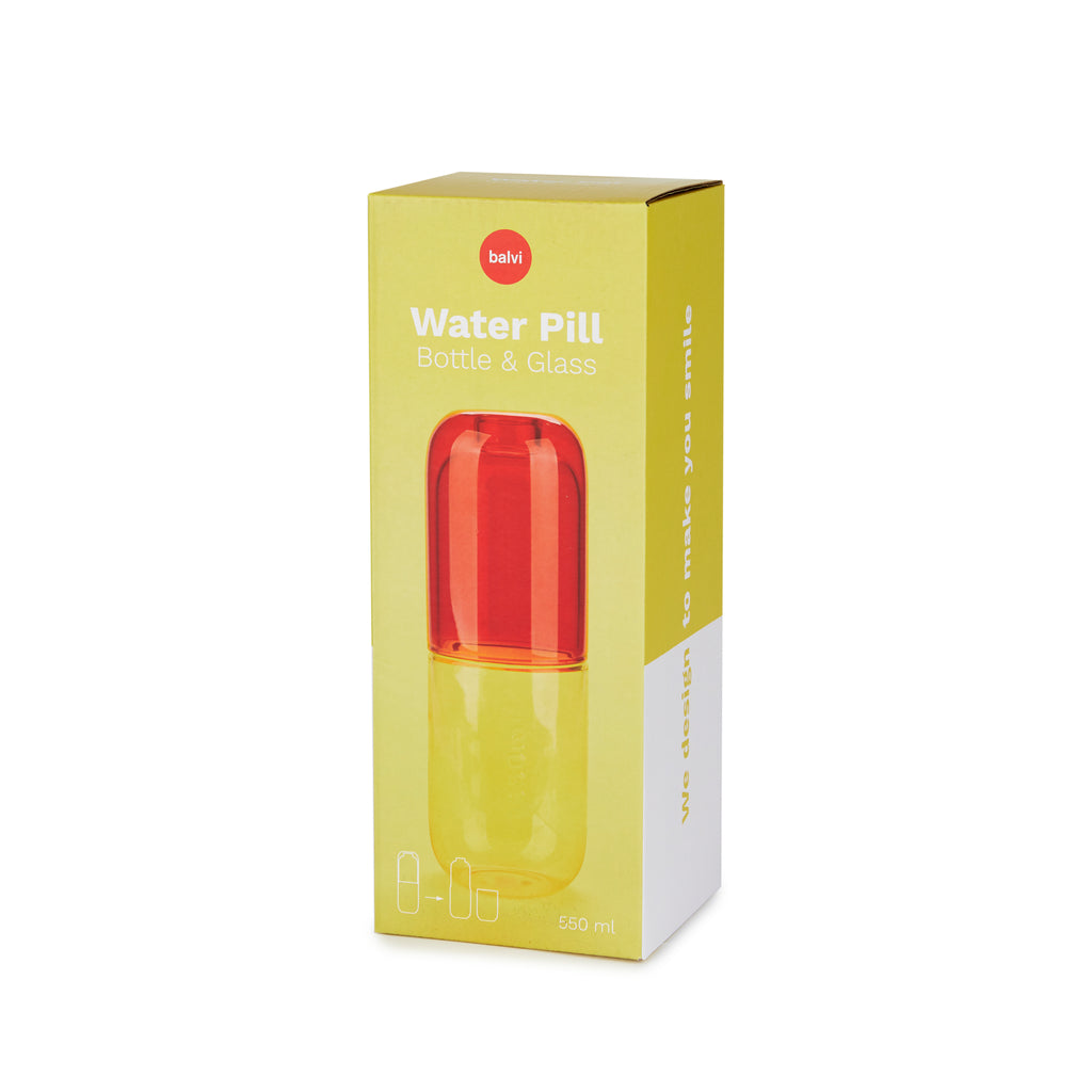 Bouteille de pilules d'eau et verre à boire