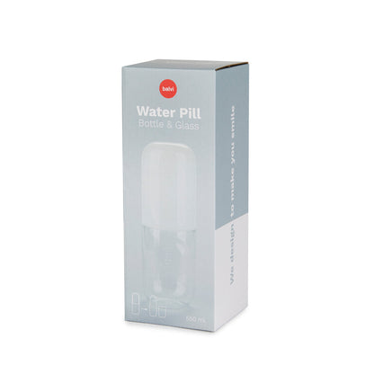 Bouteille de pilules d'eau et verre à boire