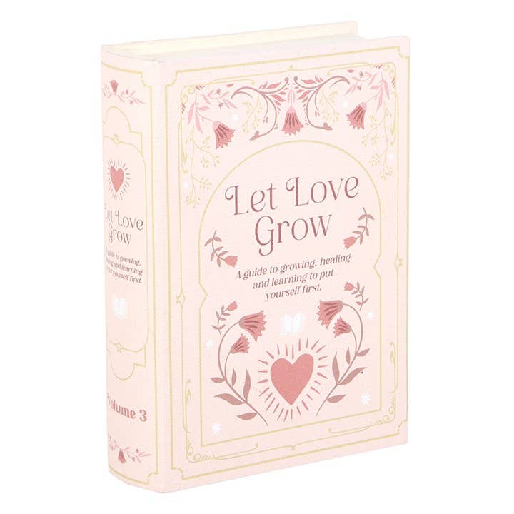 Roze opbergdoos in de vorm van een boek