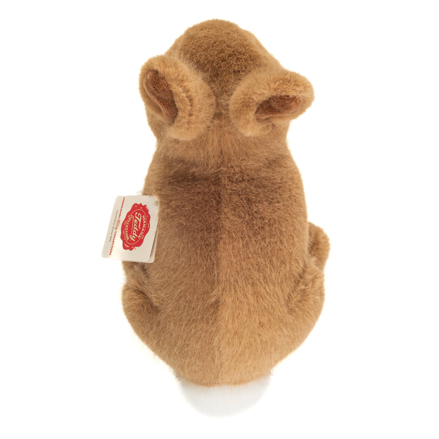 Pluche knuffel van een zittend bruin konijn