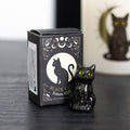 Set of 24 black cat tokens on a display stand