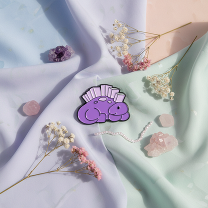 Pin's Spinosaure Bibliophile