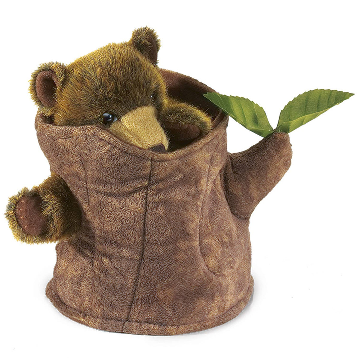 Hand puppet of a bear in a tree trunk