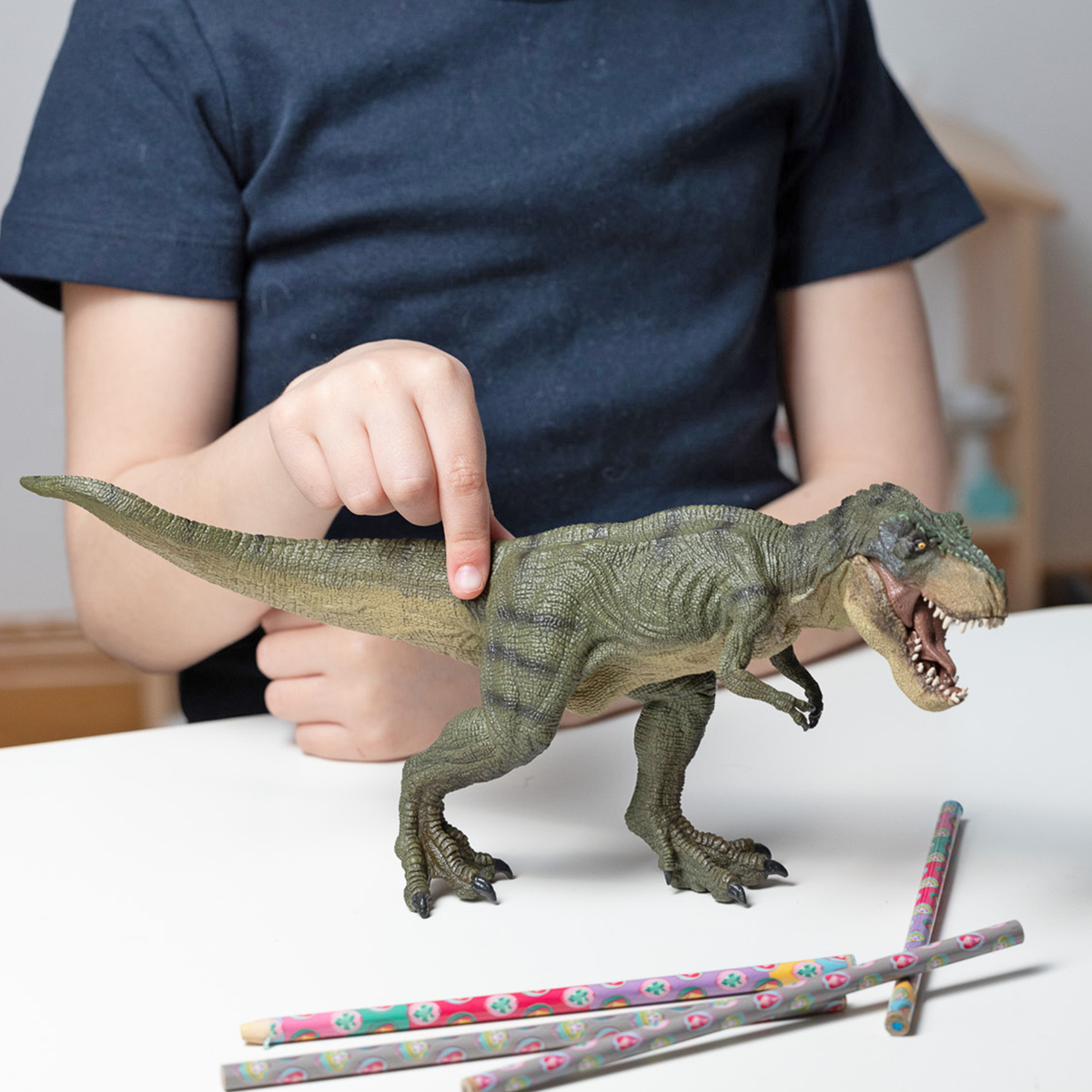 Running green T-Rex figurine