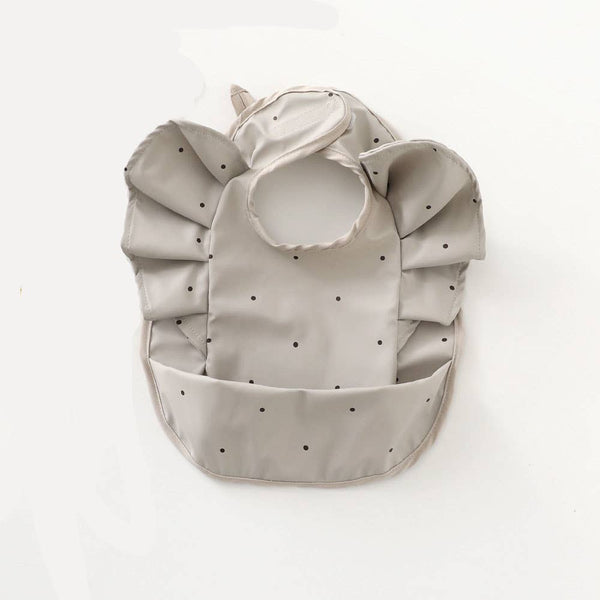 Grey waterproof frilly bib with polka dots
