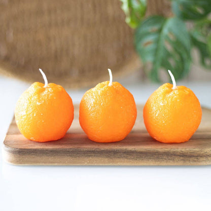 Set of 3 orange-shaped candles
