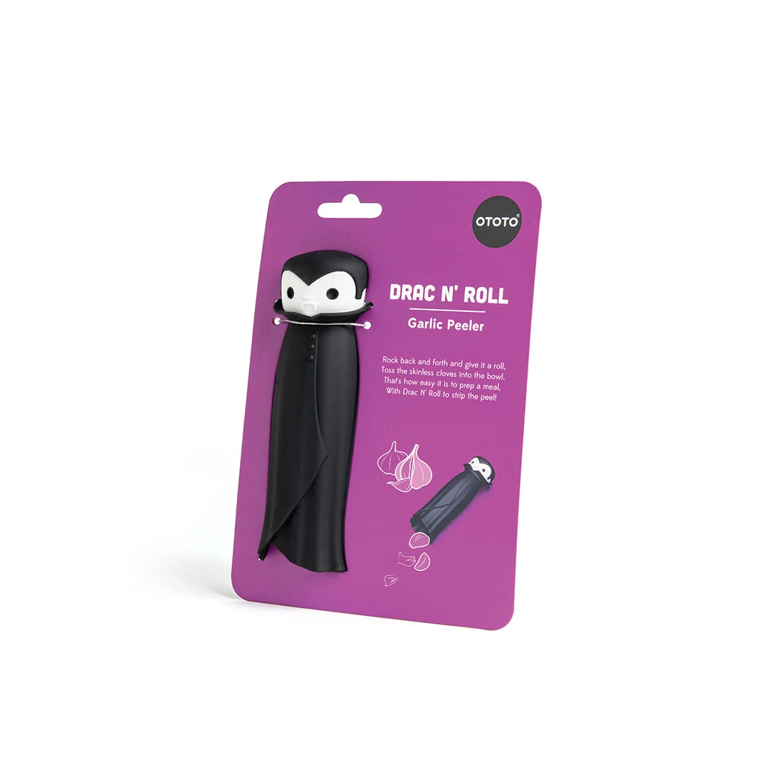 The Drac N Roll garlic peeler sports a fun vampire design on vibrant purple packaging.
