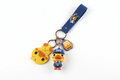 Sleutelhanger eend in schooluniform