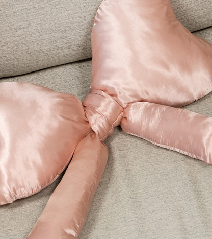Satin knot cushion