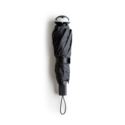 Stylish Spookula umbrella by OTOTO, features a penguin handle and wrist strap, on a white background.