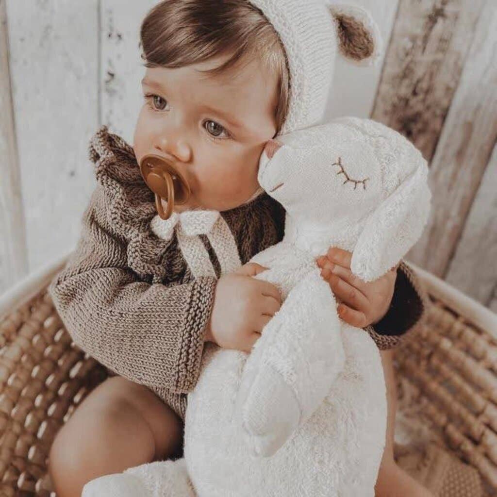 Large cuddly white sheep-shaped heating pad