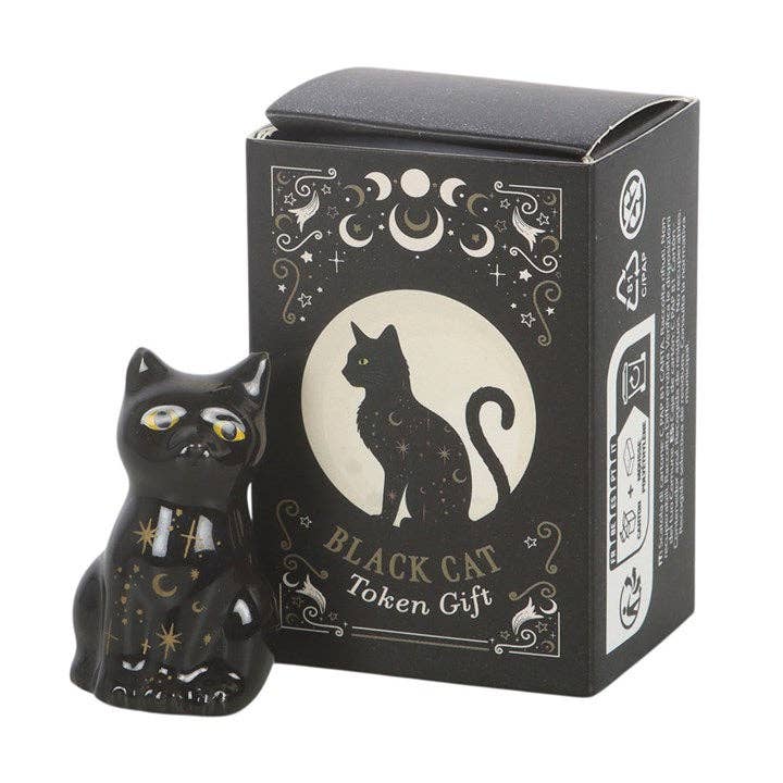 Set of 24 black cat tokens on a display stand