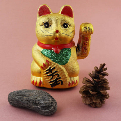 Maneki-neko lucky cat in the shape of a wave, ceramic, 17 cm, gold