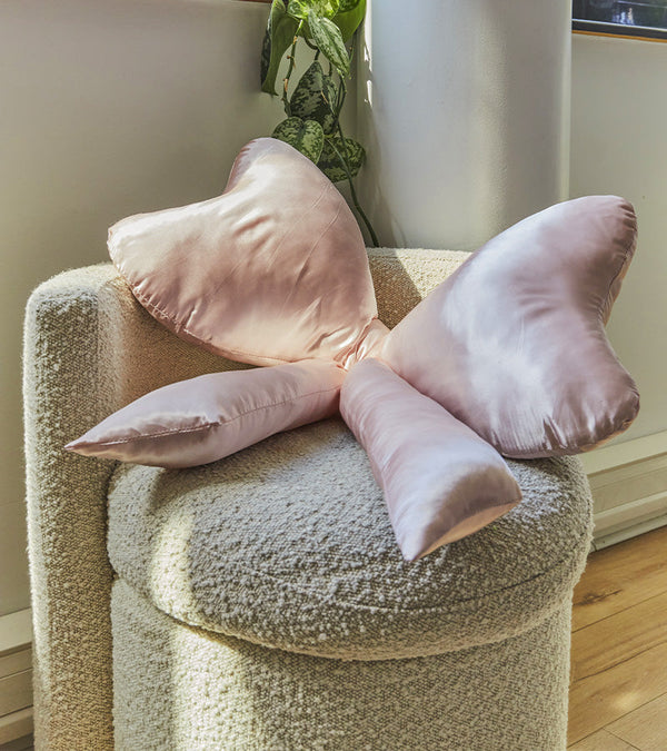 Satin knot cushion