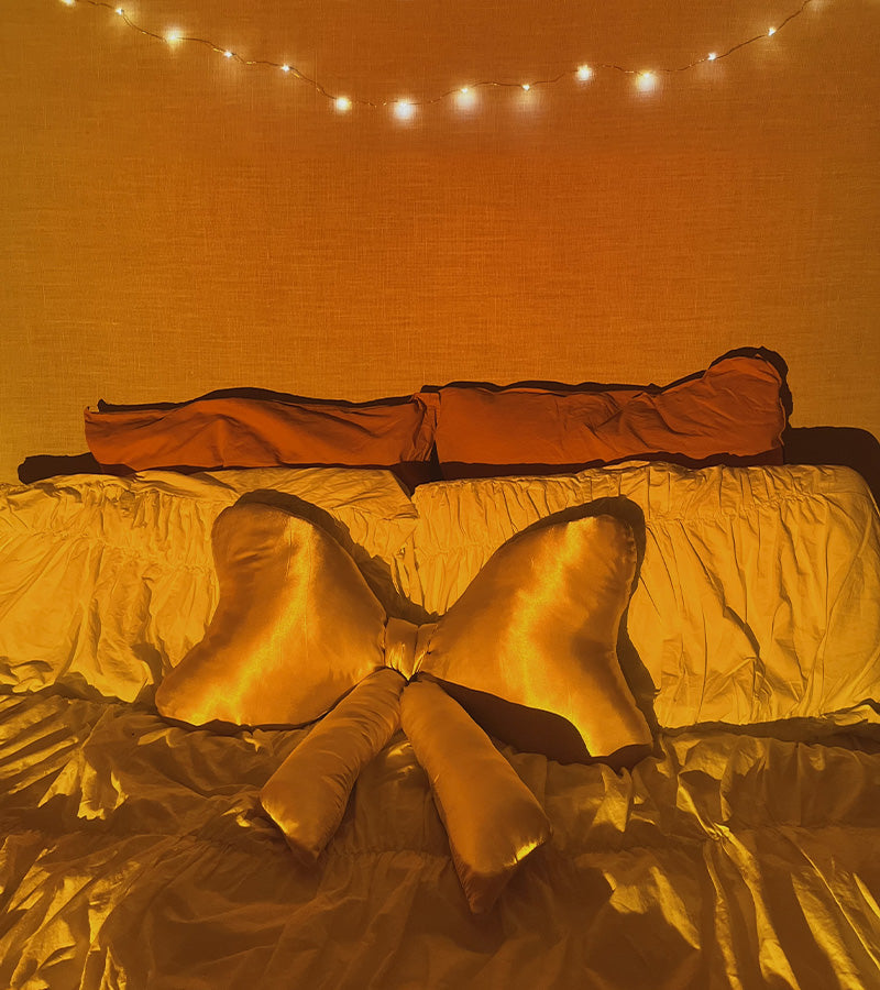 Satin knot cushion