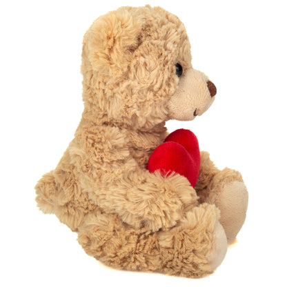 Beige teddy bear with a heart