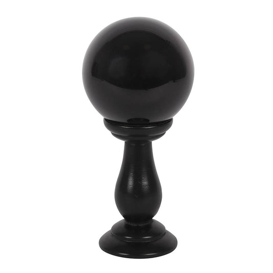 Small black crystal ball on a stand