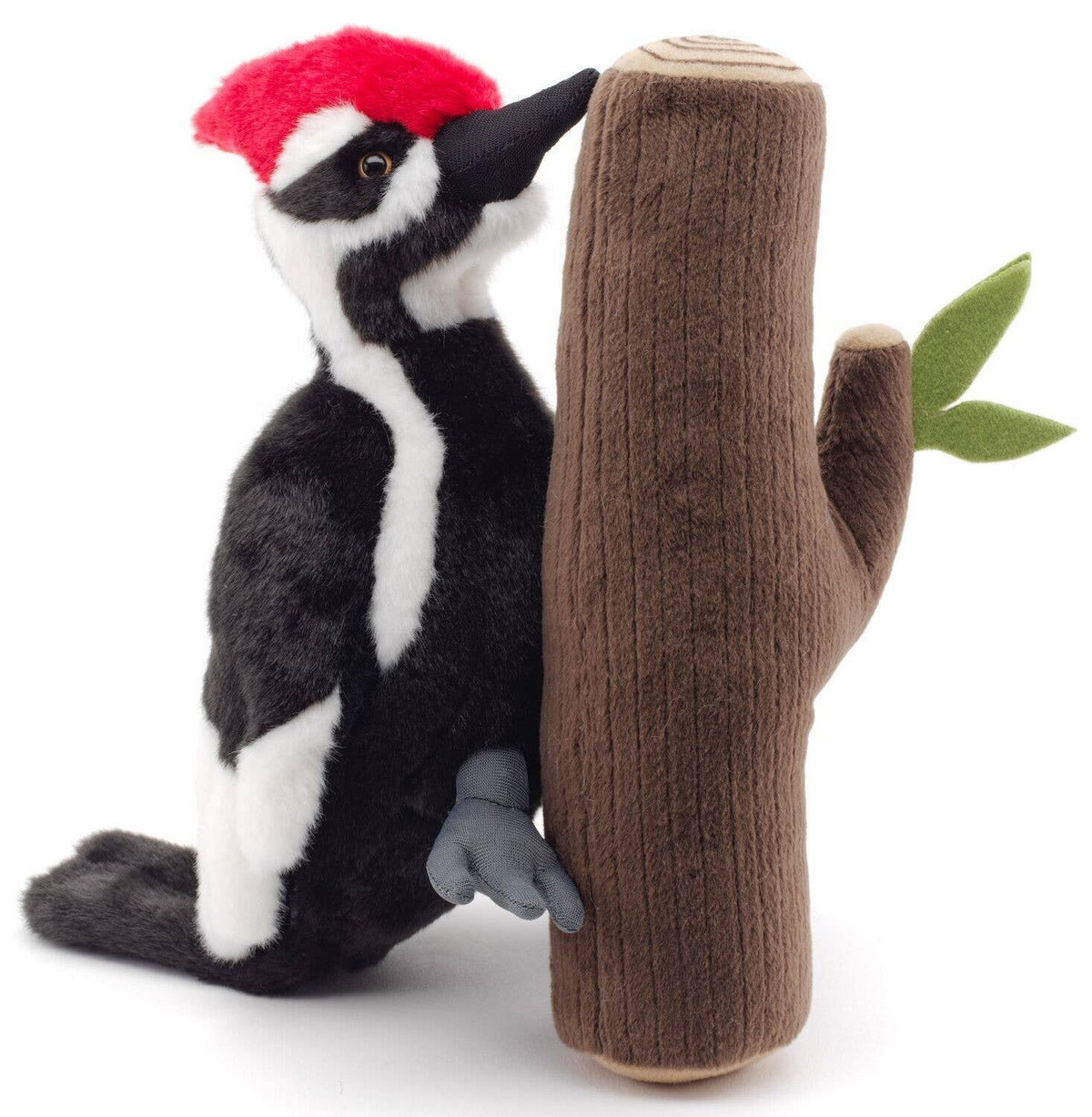 Woodpecker plush on the tree trunk